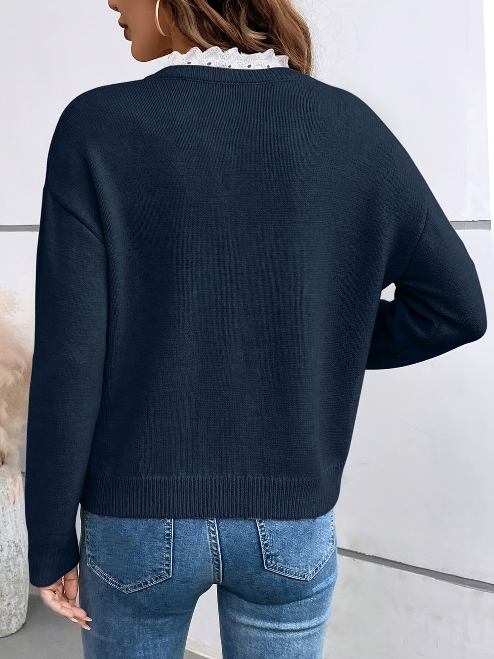 Le pull que l'on prend en premier.
