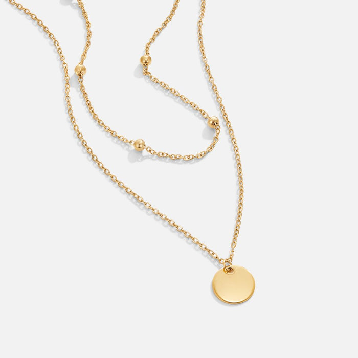 Collier double chaîne en or avec pendentif