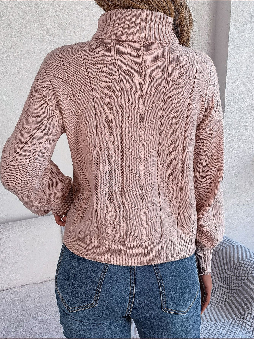 Le pull que l'on prend en premier.