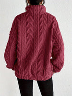 Cassandre | Pull torsadé à col montant zippé