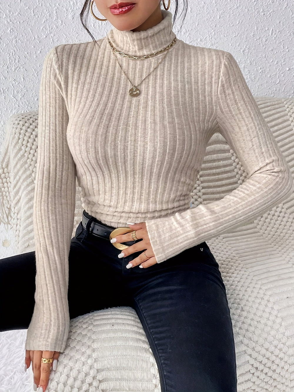 Le pull que l'on prend en premier.