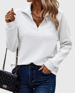 Pull élégant à demi zip