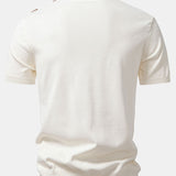 Ensemble Améline — polo en maille jacquard géométrique rayée & pantalon fuselé