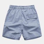 Ensemble Améline — chemise à imprimé palmiers & short de bain à imprimé rayé