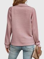Pull élégant à demi zip