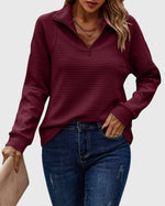 Pull élégant à demi zip