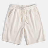Ensemble — polo gaufré à col V & short gaufré en maille à cordon