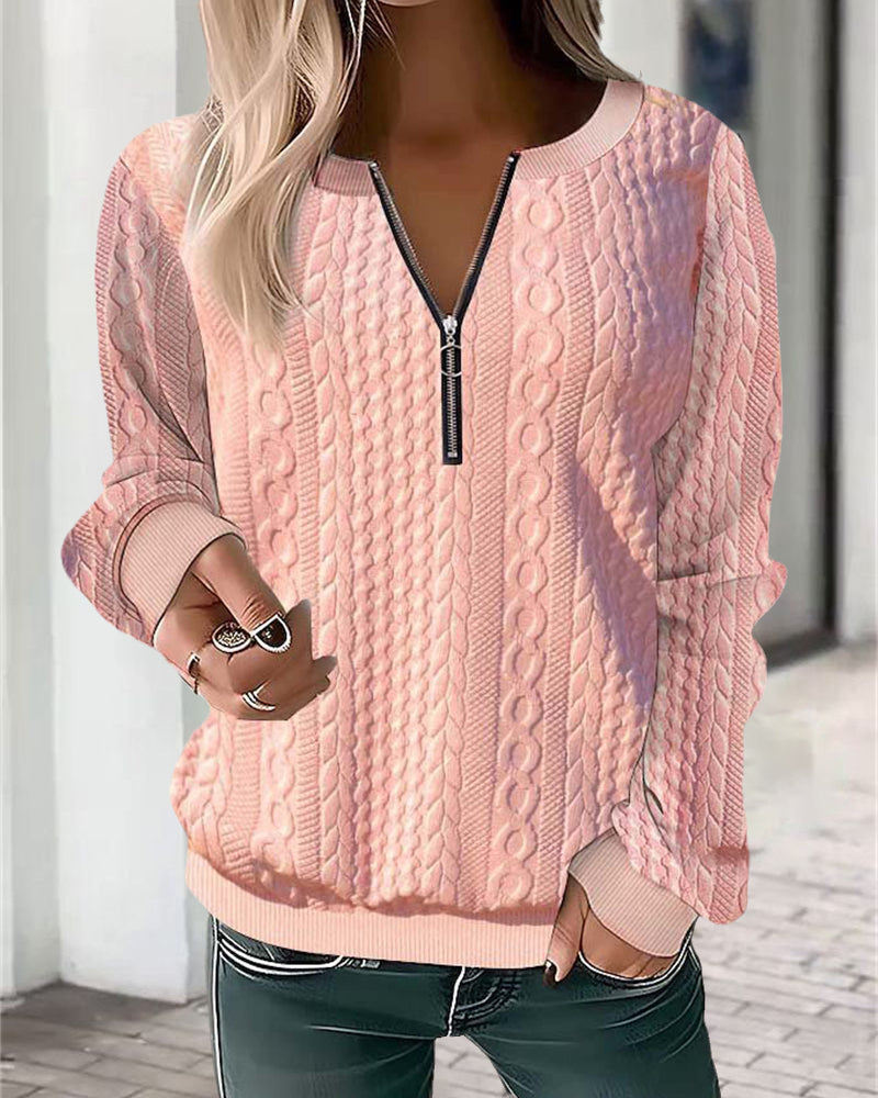 Mira | Pull à torsades zippé Rose, photo studio