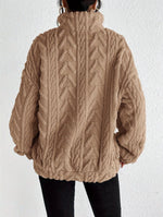 Cassandre | Pull torsadé à col montant zippé