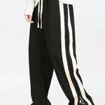 Ensemble — sweat polo patchwork color block & pantalon rayé à ourlet fendu