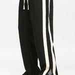 Ensemble — sweat polo patchwork color block & pantalon rayé à ourlet fendu