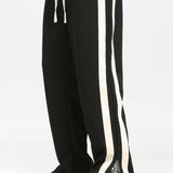 Ensemble — sweat polo patchwork color block & pantalon rayé à ourlet fendu