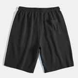 Ensemble — polo gaufré à col V & short gaufré en maille à cordon
