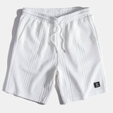 Ensemble — polo jacquard géométrique & short