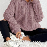 Cassandre | Pull torsadé à col montant zippé