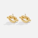 Margaux – Boucles d’oreilles dorées dalla forme tressée.