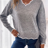 Arlette | Pull en maille à col V et bordure ondulée
