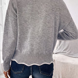 Arlette | Pull en maille à col V et bordure ondulée