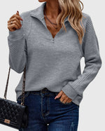 Pull élégant à demi zip