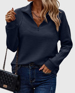 Pull élégant à demi zip