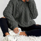 Cassandre | Pull torsadé à col montant zippé