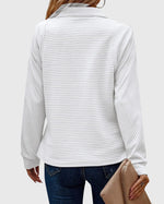 Pull élégant à demi zip