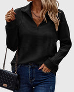 Pull élégant à demi zip