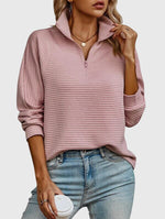 Pull élégant à demi zip