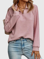 Pull élégant à demi zip