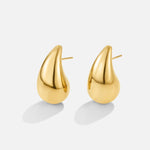 Anne – Boucles d’oreilles créoles en or avec une courbe délicate