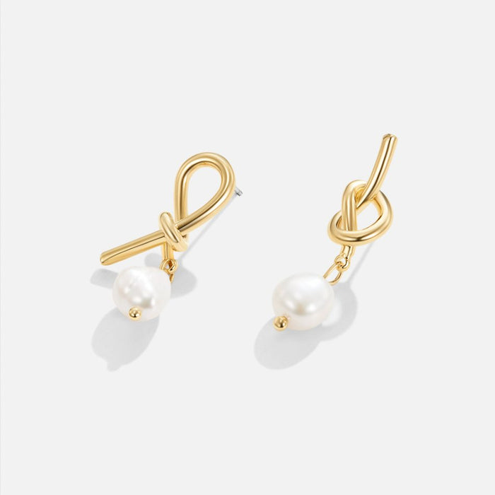 Boucles d’oreilles en argent à la forme courbe