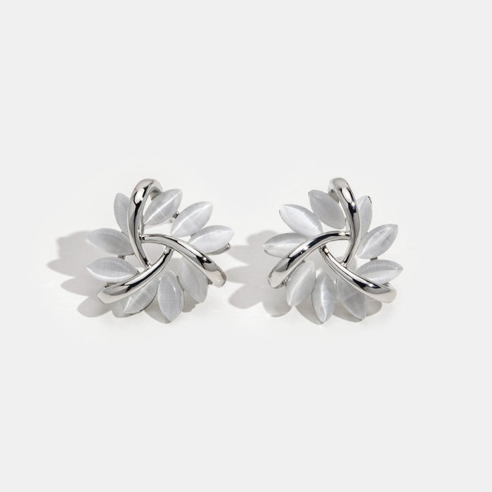 Boucles d’oreilles en argent a forma di fiore.