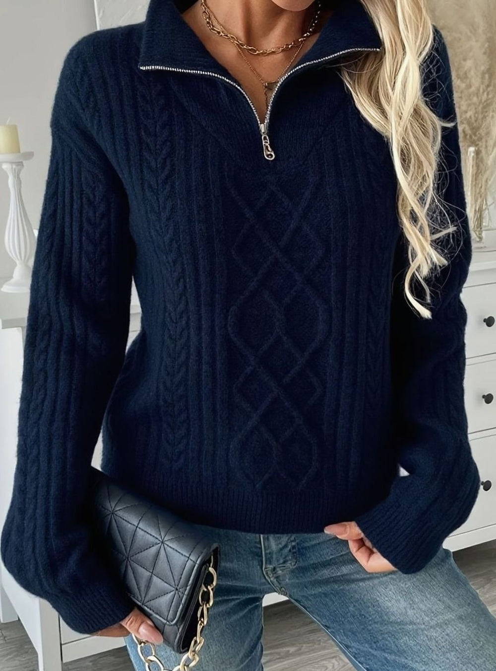 Le pull que l'on prend en premier.