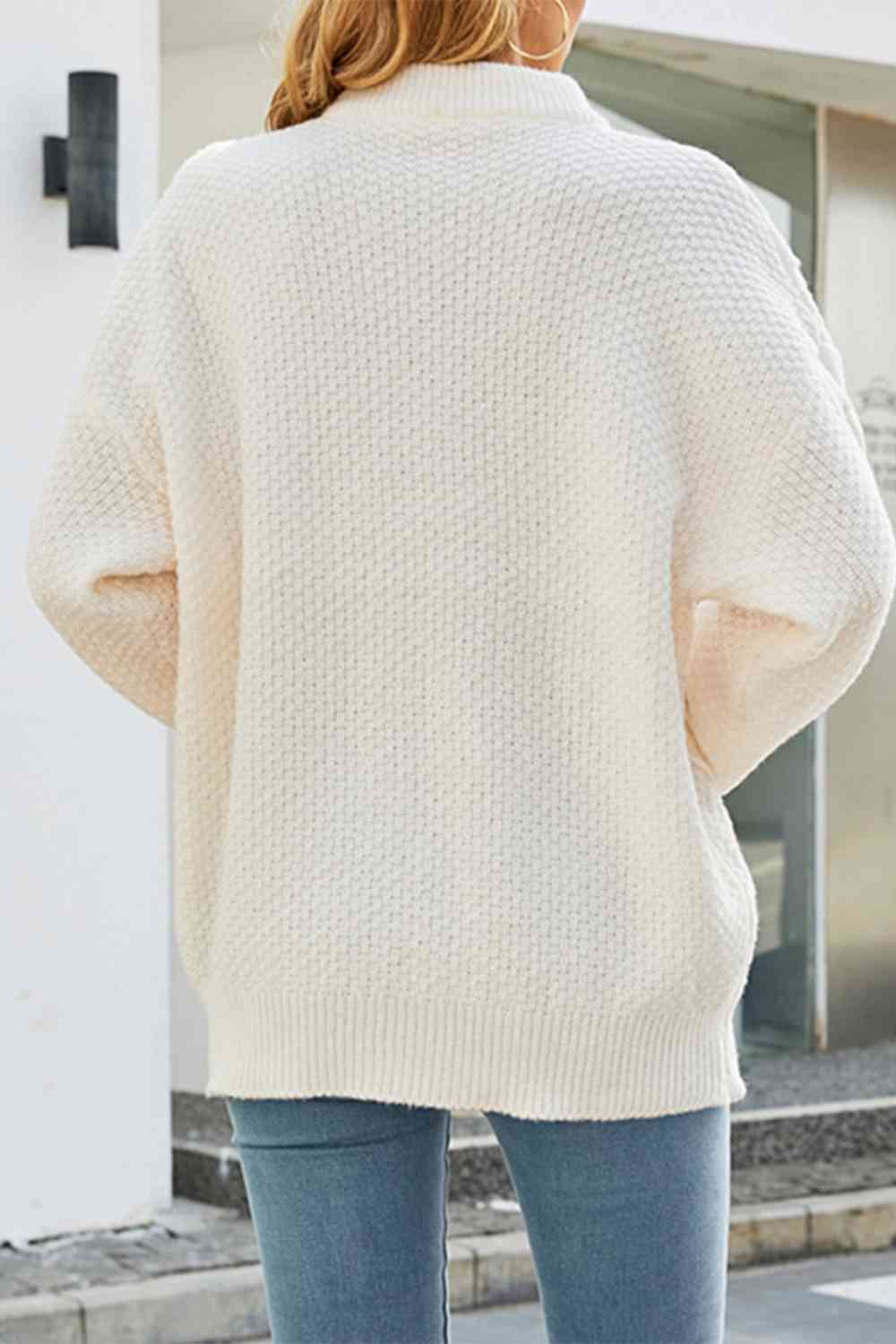 Le pull que l'on prend en premier.